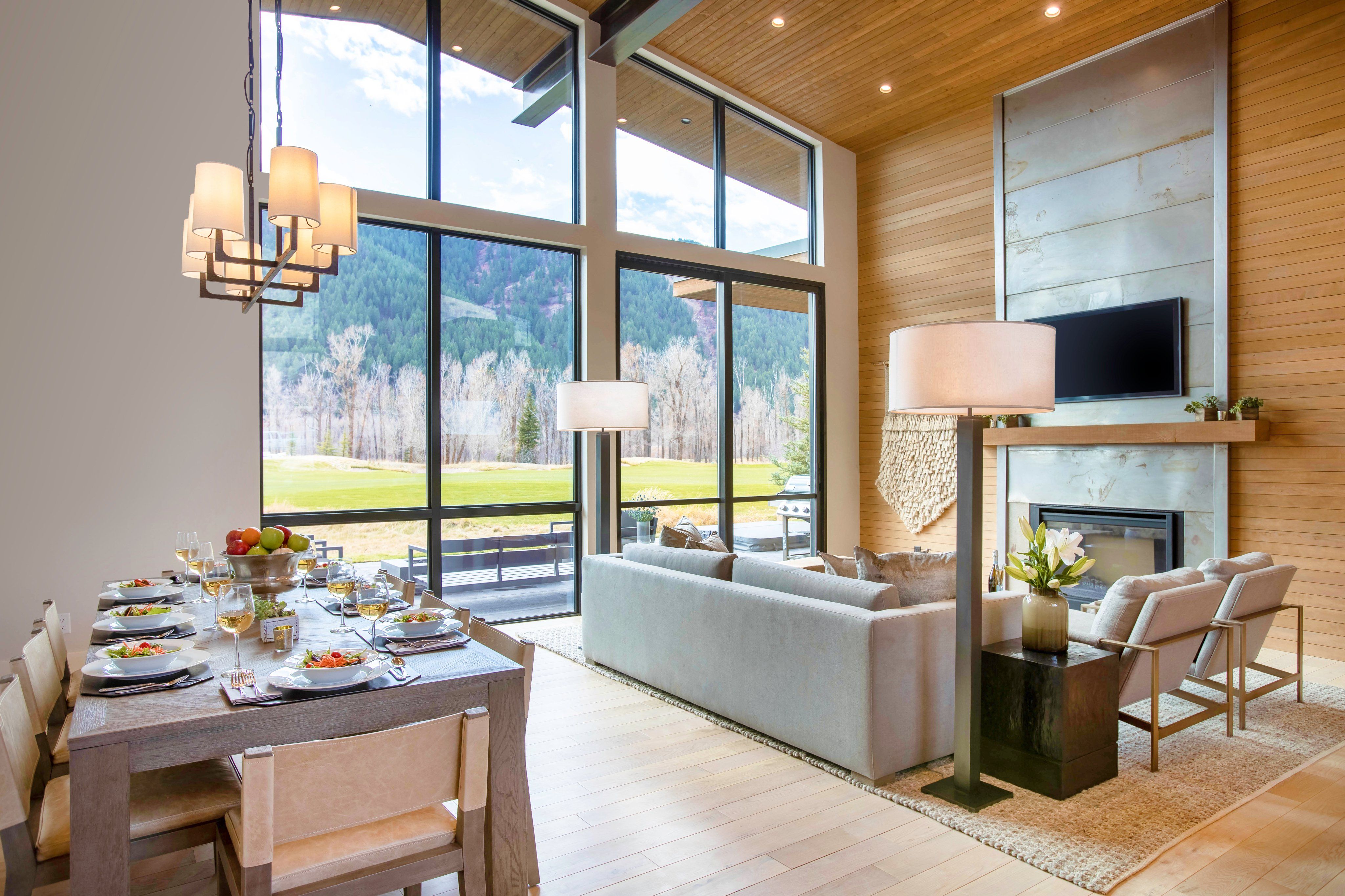 image Dining area with an outdoor view through full-height windows — mountain light shifts throughout the day