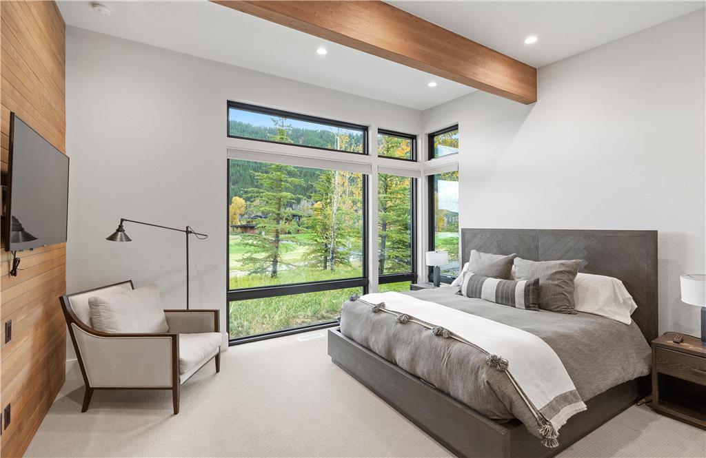 image King bedroom with large windows and abundant natural light — private en-suite with radiant heated floors