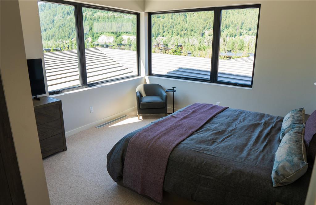 image Bedroom with large picture windows and soft natural light