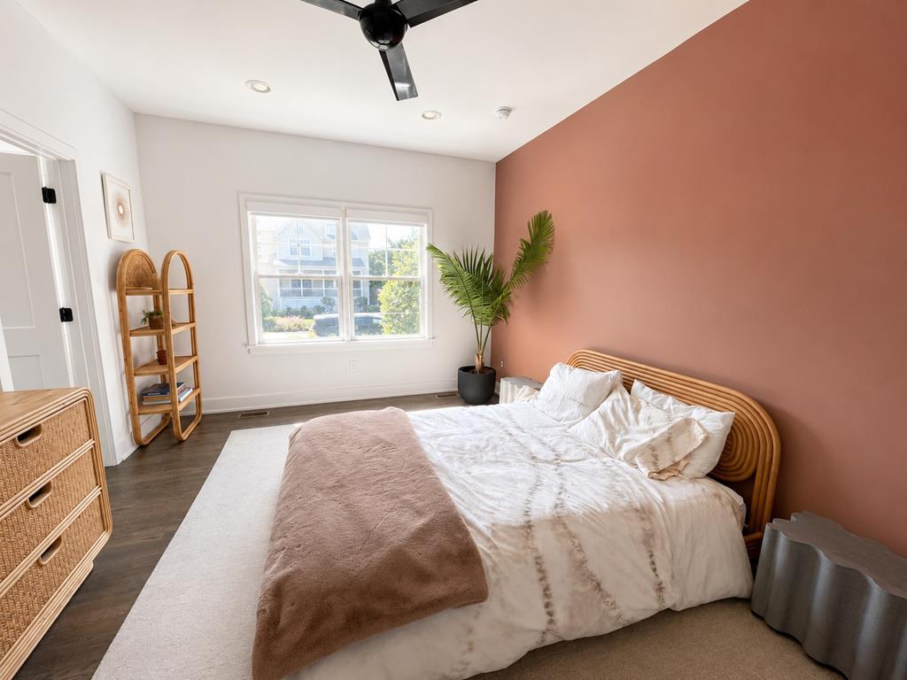 image Relax in a stylish bedroom adorned with warm hues and natural accents, inviting comfort after a day at the beach.