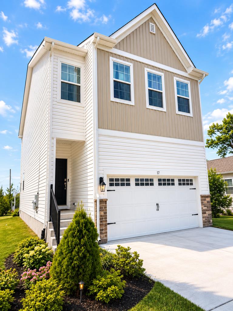 image Welcome to your stylish getaway, featuring a bright facade and lush landscaping for a charming first impression.