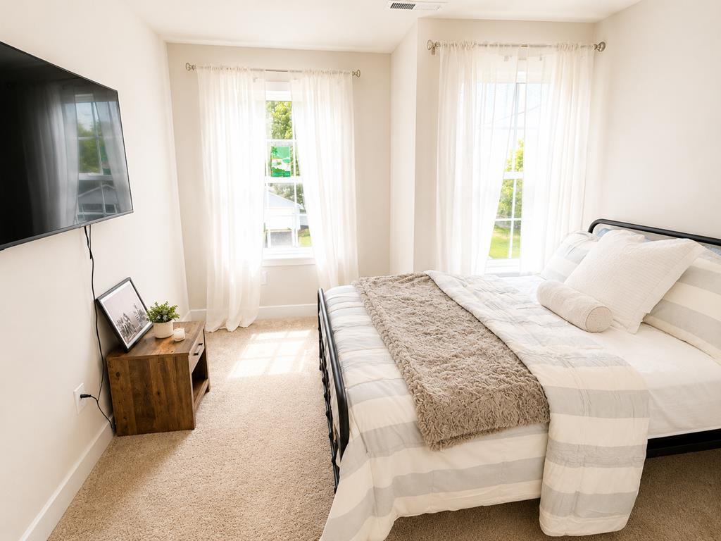 image Find your peace in a bright, airy bedroom, perfect for restful nights and rejuvenating mornings.