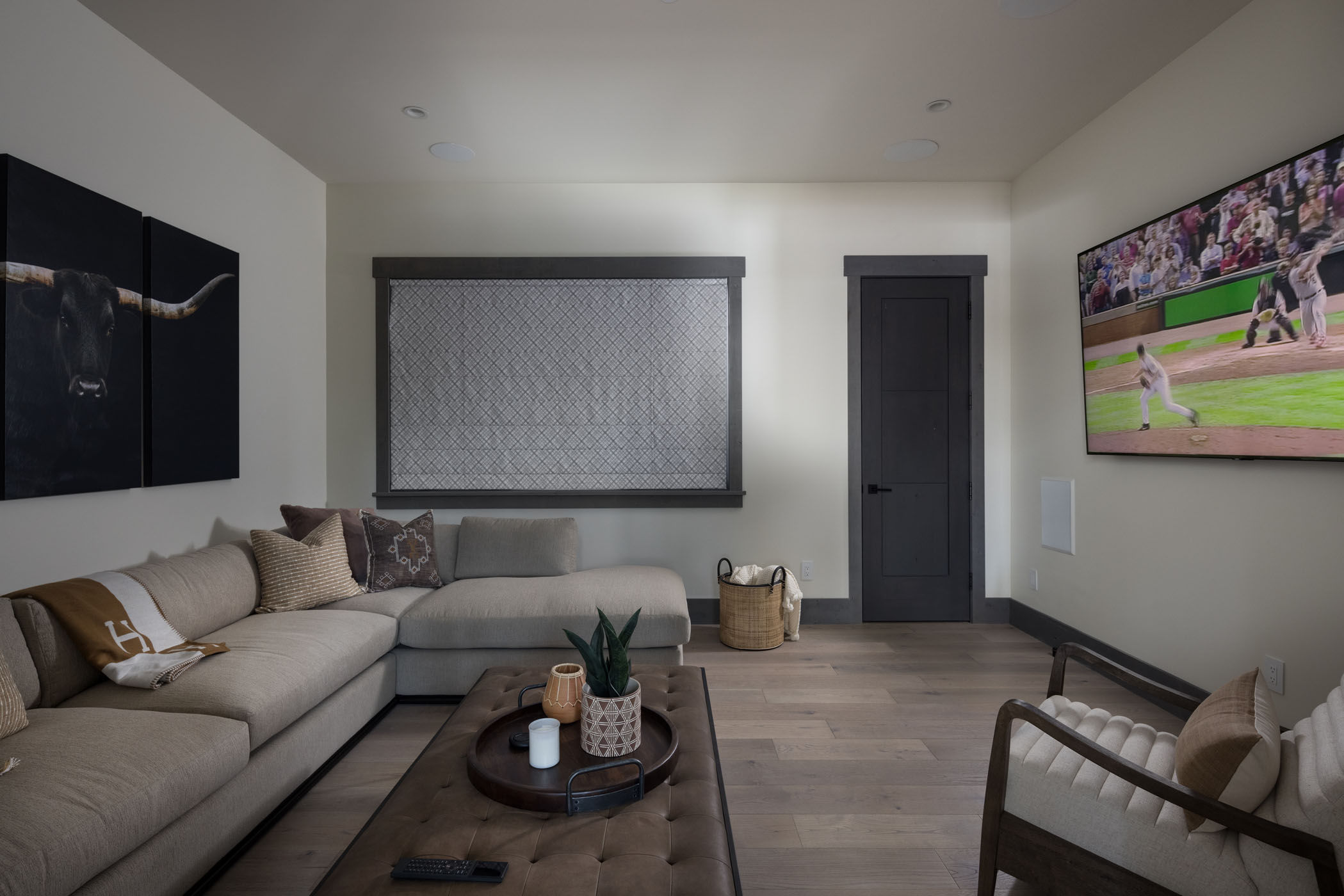 image Sink into the L-shaped couch for movie night in the dedicated media room.