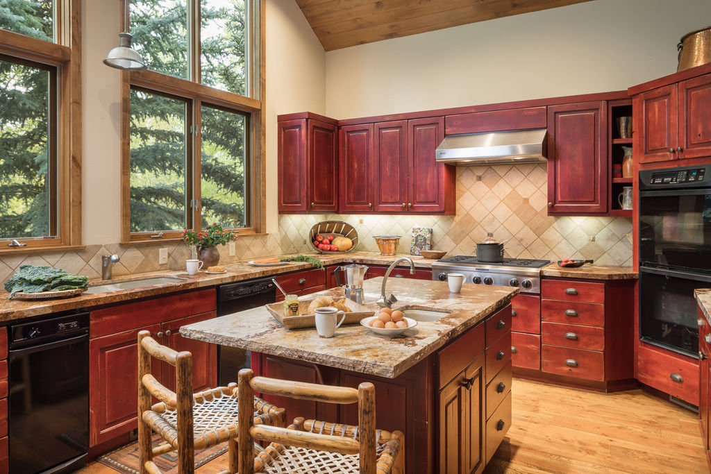 image Two barstools sit at the counter, with windows framing the forest beyond as you sip your coffee.