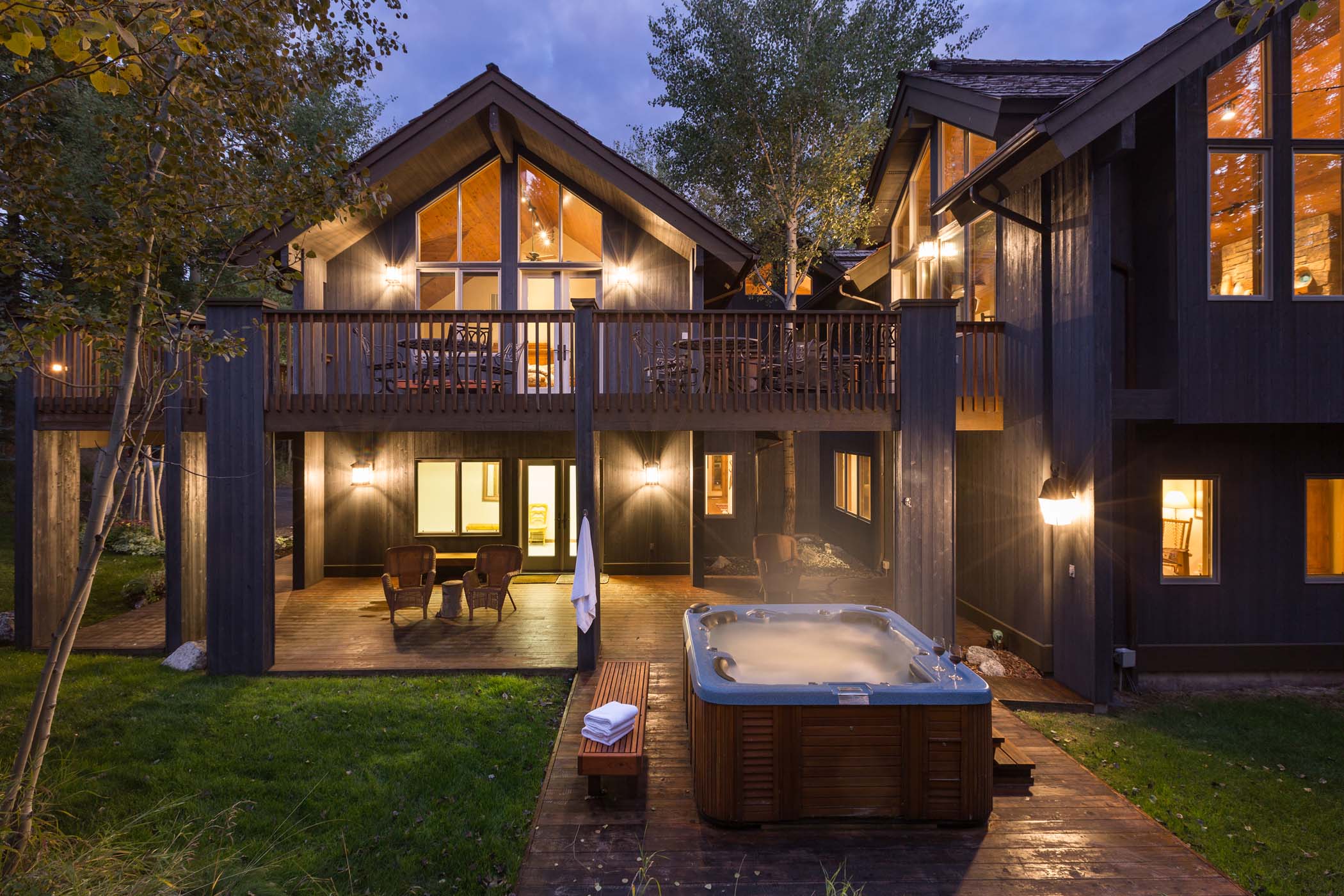 image The back of the home opens onto a deck with a private hot tub.