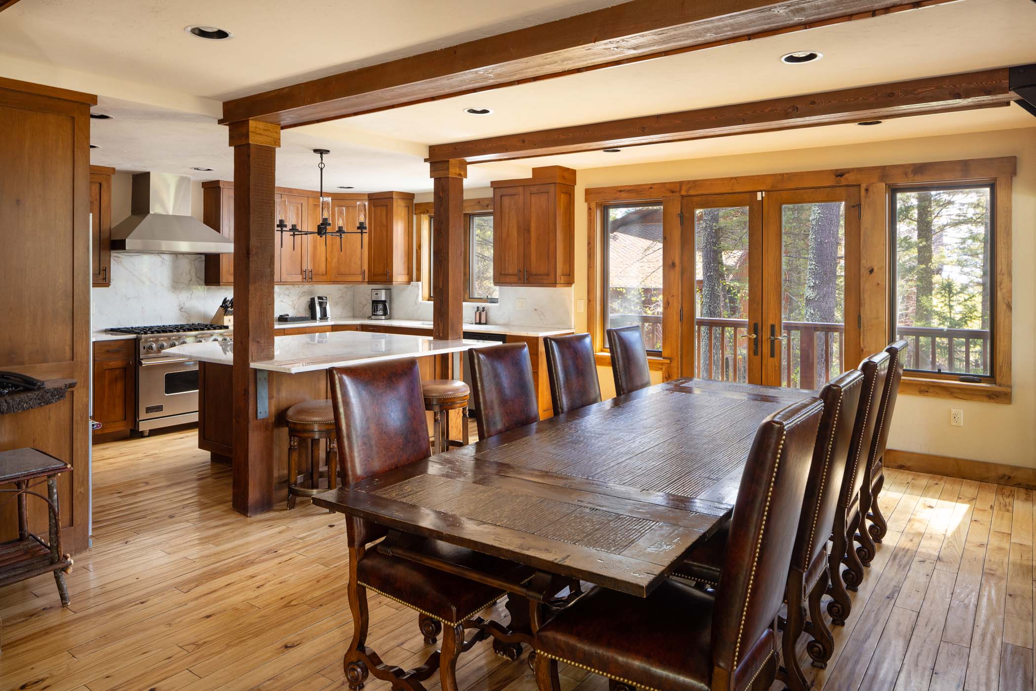 image Professional-grade appliances equip the chef's kitchen beside the dining area.