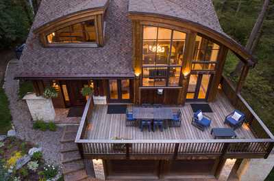 The wrap-around deck connects directly to the great room below.