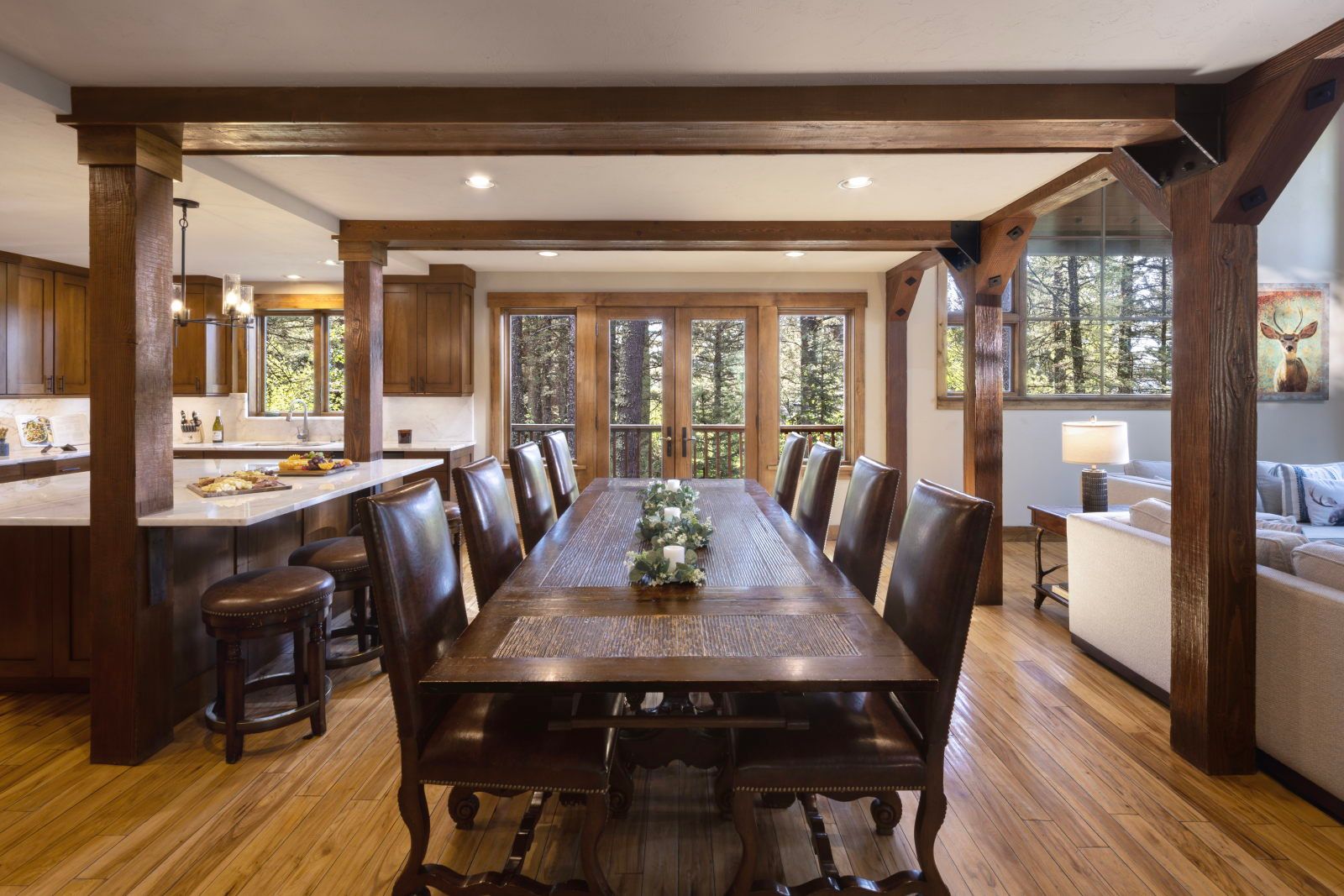 image Gather around the wood dining table for meals from the chef's kitchen, equipped with professional-grade appliances.