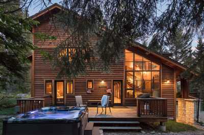Unwind in the private hot tub on the back deck as evening settles in.