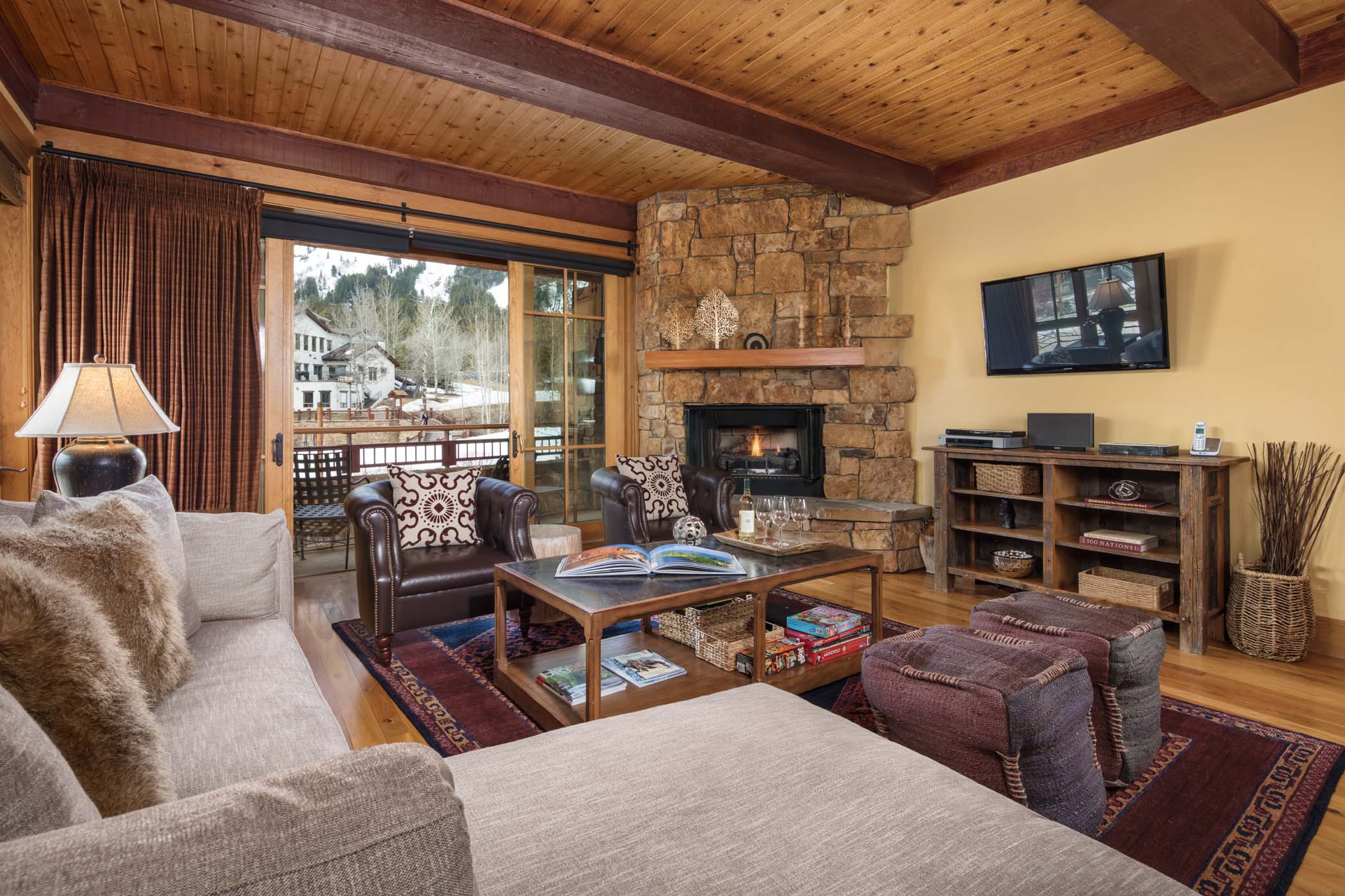 image Sink into the living room seating with mountain views through the windows.