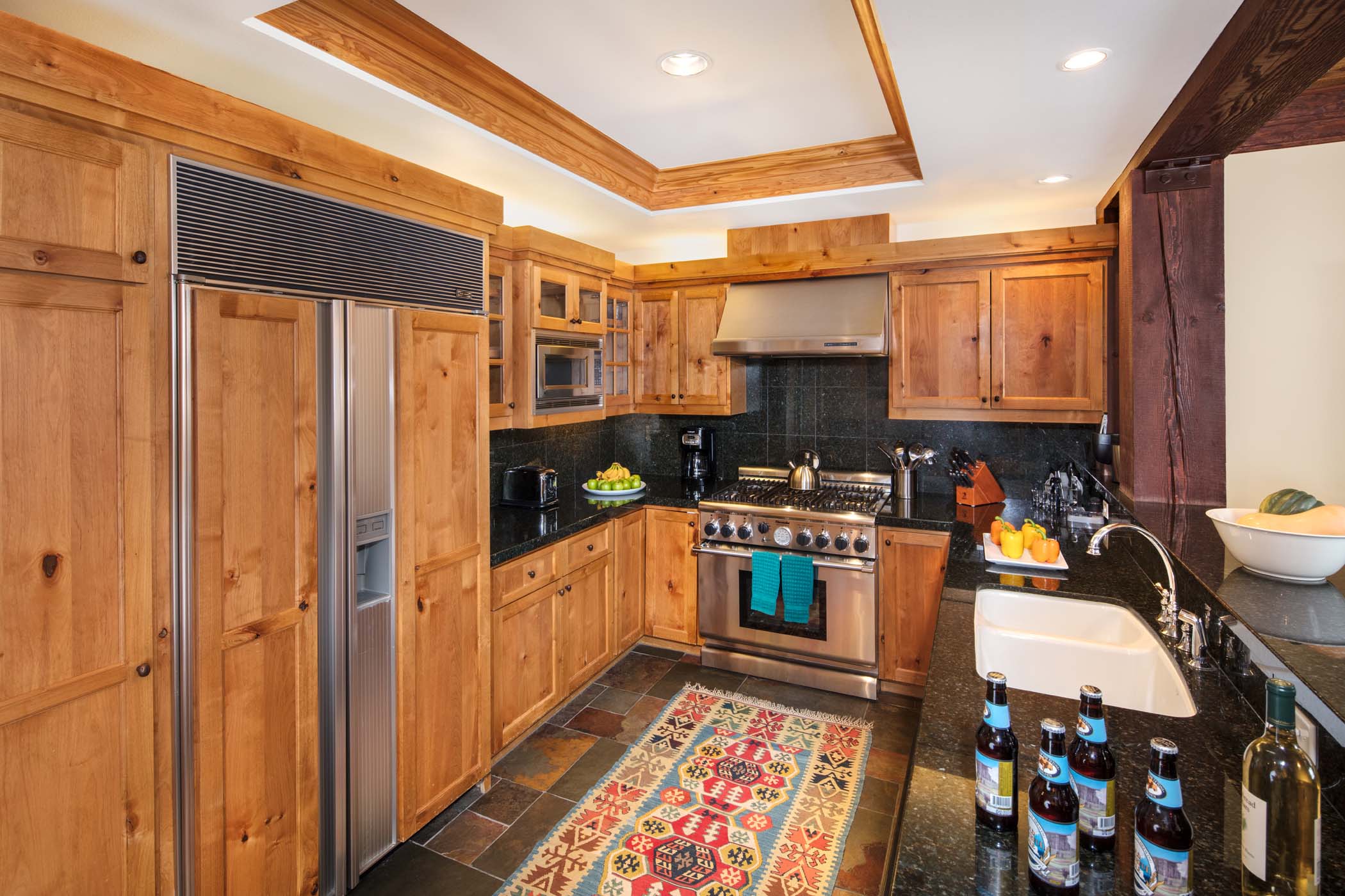 image Bar seating lines the fully equipped kitchen for casual meals.