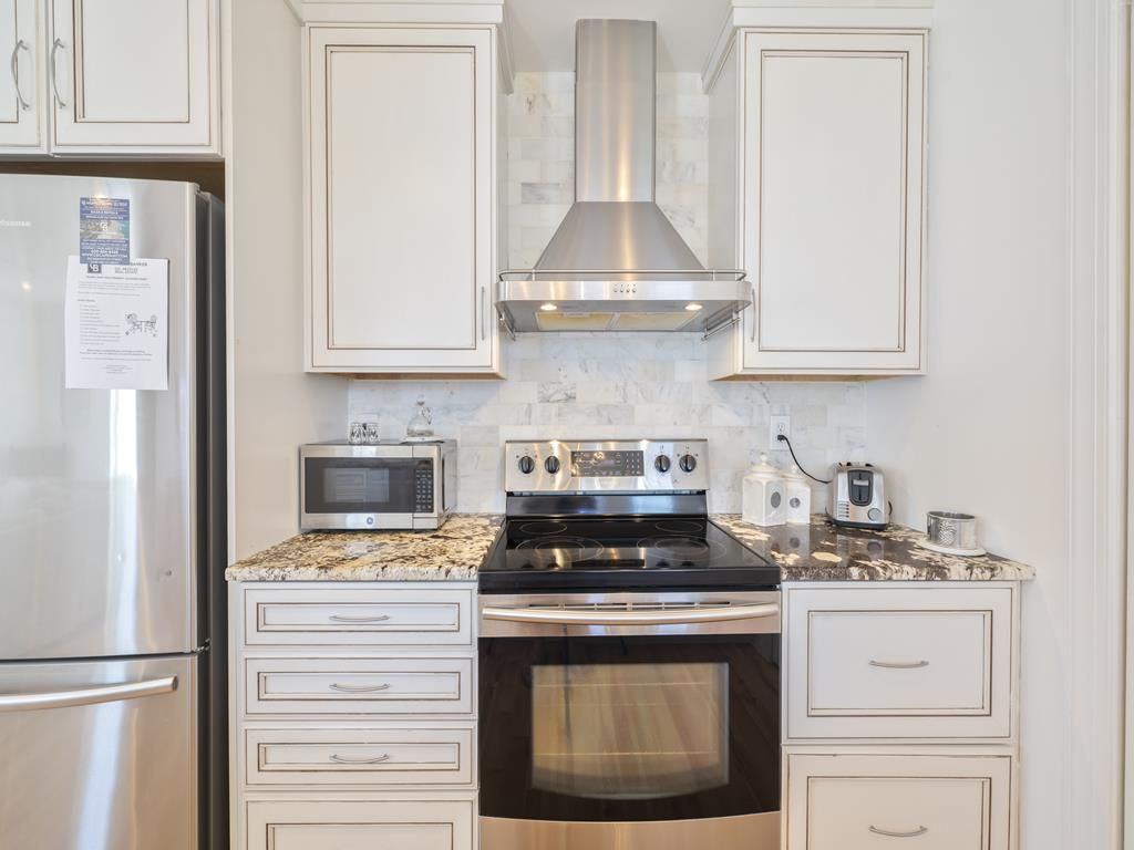 image Kitchen with stainless steel appliances and granite countertops