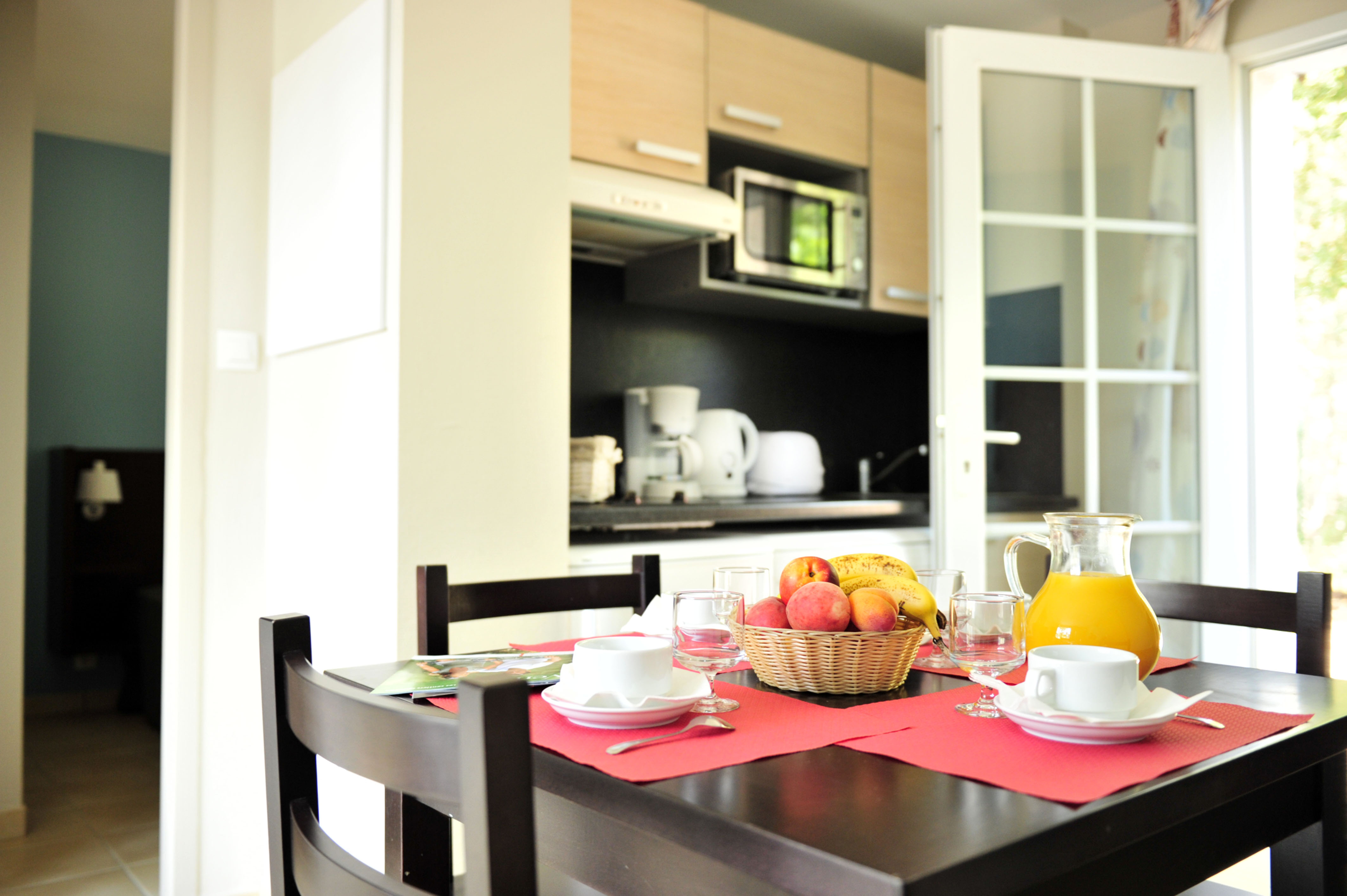 image The open kitchen keeps things simple, with everything on hand for a quick breakfast before heading to the pool.