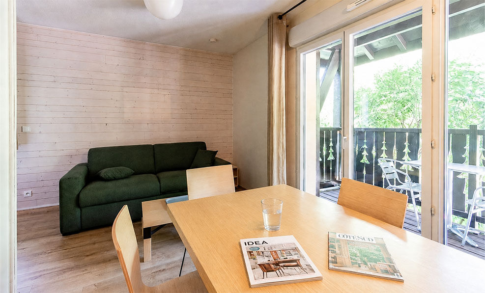 image Glass doors open the living area to mountain air, just steps from the Ax-Bonascre lift year-round.