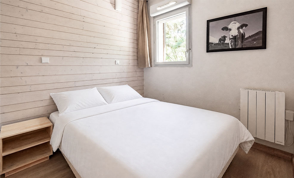 image The bedroom's queen bed faces greenery leading up toward Ax 3 Domaines.