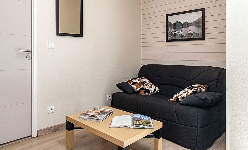 image The fold-out sofa adds sleeping space for a bigger group visiting the ski area or summer trails together.