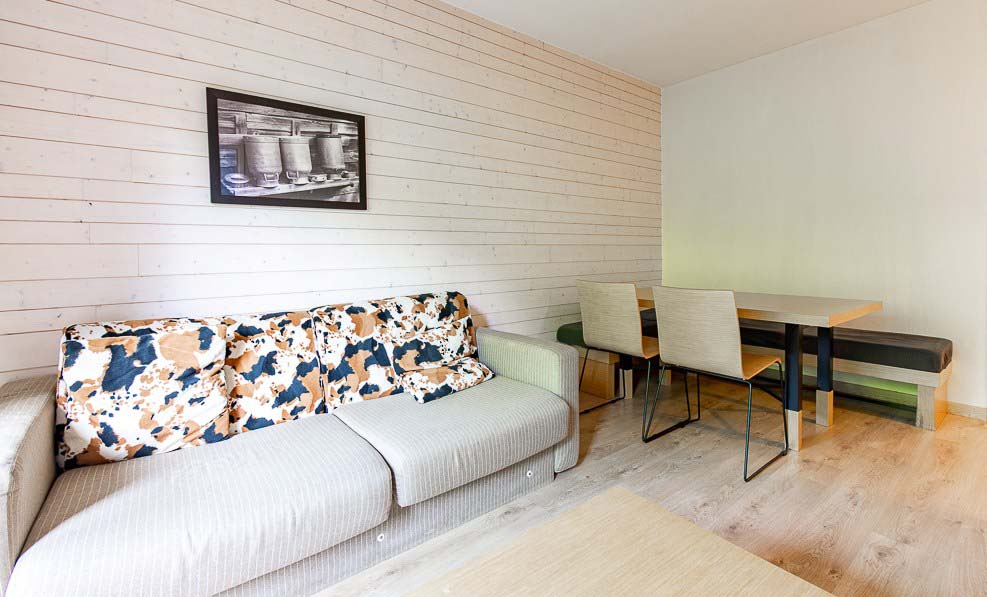 image The sofa and dining space give the whole group room to gather before heading out for the day.