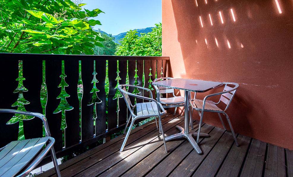 image The balcony faces the ridgelines that frame the Ax 3 Domaines area, snow-capped or green.