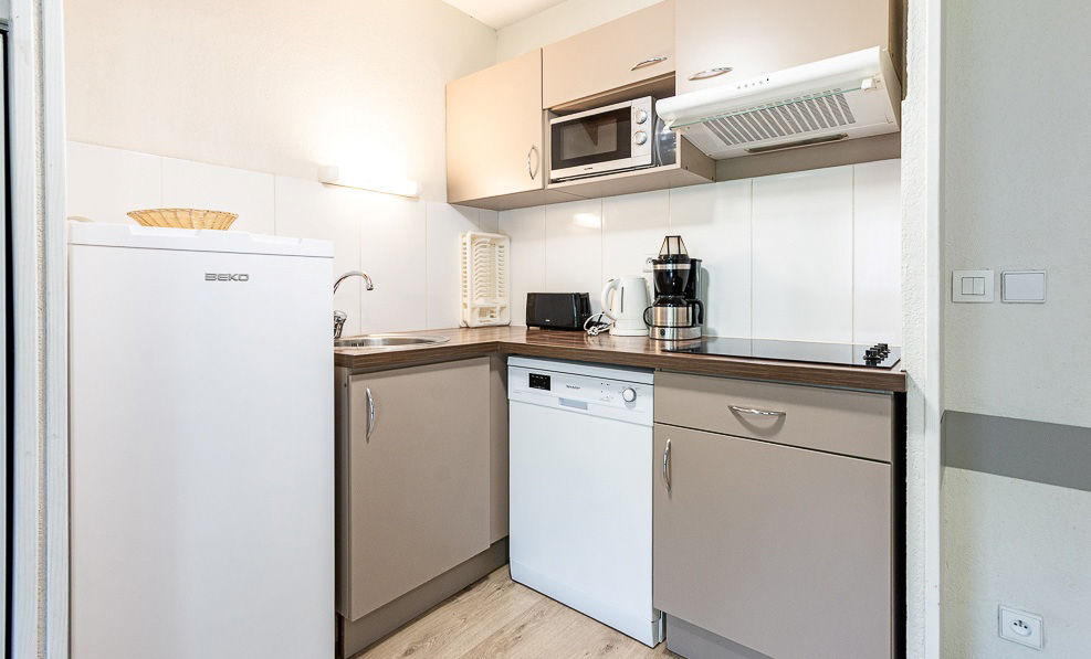 image The kitchenette's dishwasher and coffee maker keep the group fed between days at Ax 3 Domaines.