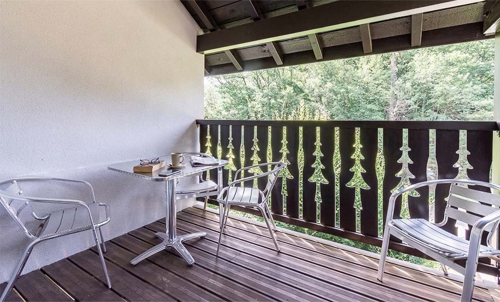 image The balcony looks over greenery toward the peaks surrounding Ax-les-Thermes, year-round.