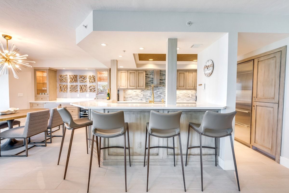 image A dining space opens onto the kitchen for easy meals together.