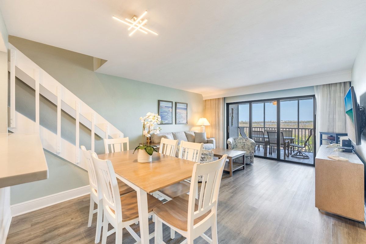 image Dining and living areas share one open space for gathering.