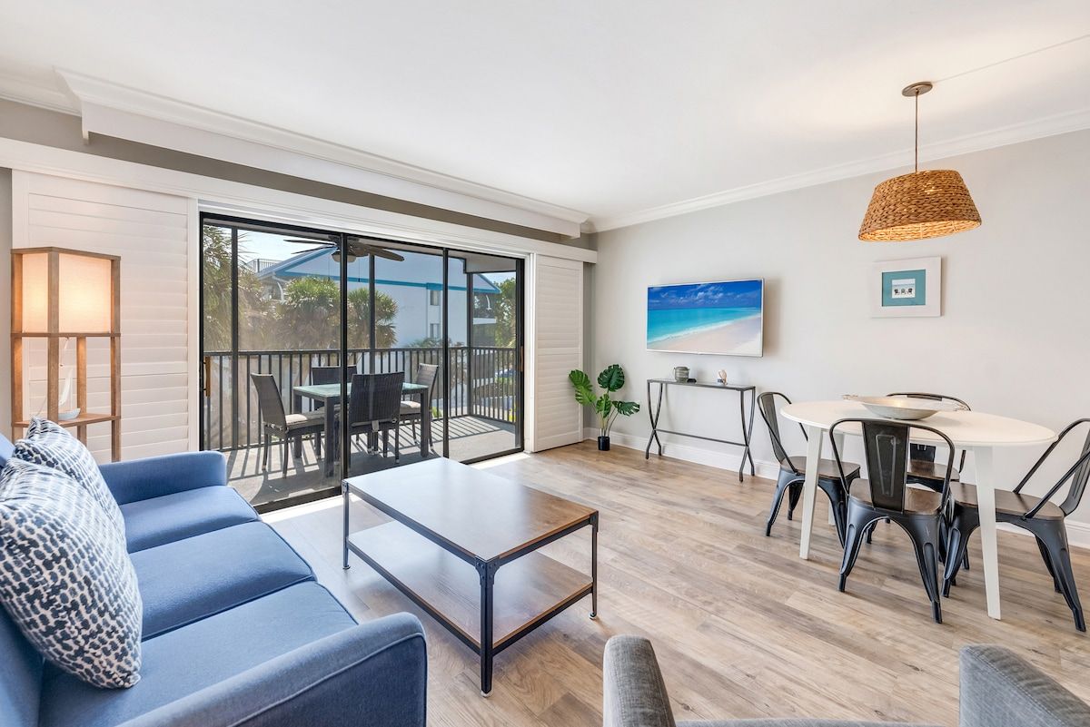 image Dining and living areas share one open space for gathering.