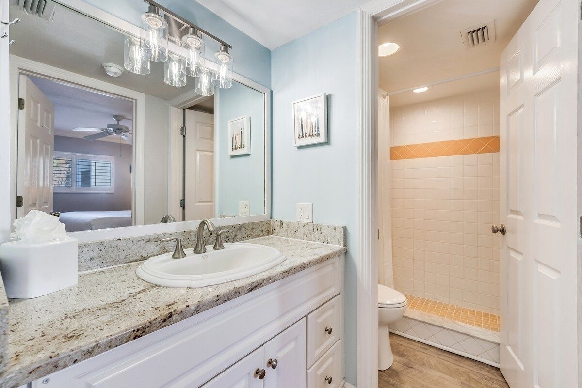 image The bathroom includes a shower and vanity.