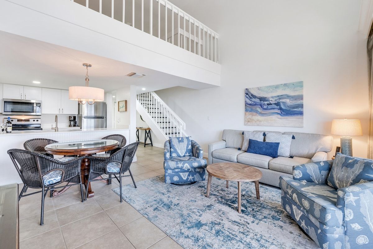 image Dining and living areas share one open space for gathering.
