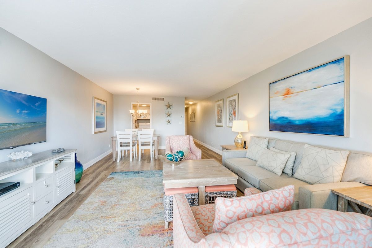 image Dining and living areas share one open space for gathering.