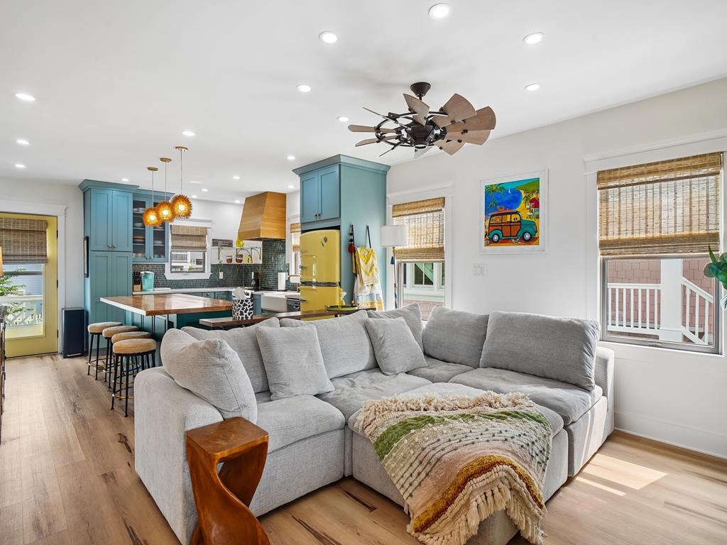 image Cozy living area with inviting seating and vibrant pops of color throughout.