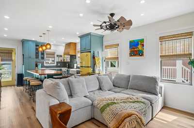 Cozy living area with inviting seating and vibrant pops of color throughout.