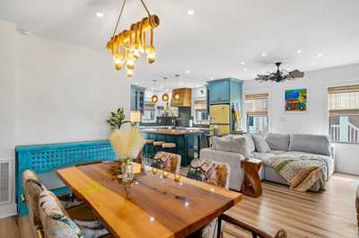 Bright open-plan layout with dining and kitchen flowing naturally together.