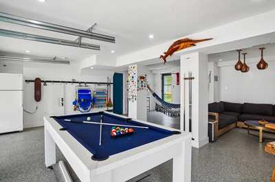 Recreational room with a hammock, pool table, and relaxed coastal atmosphere.