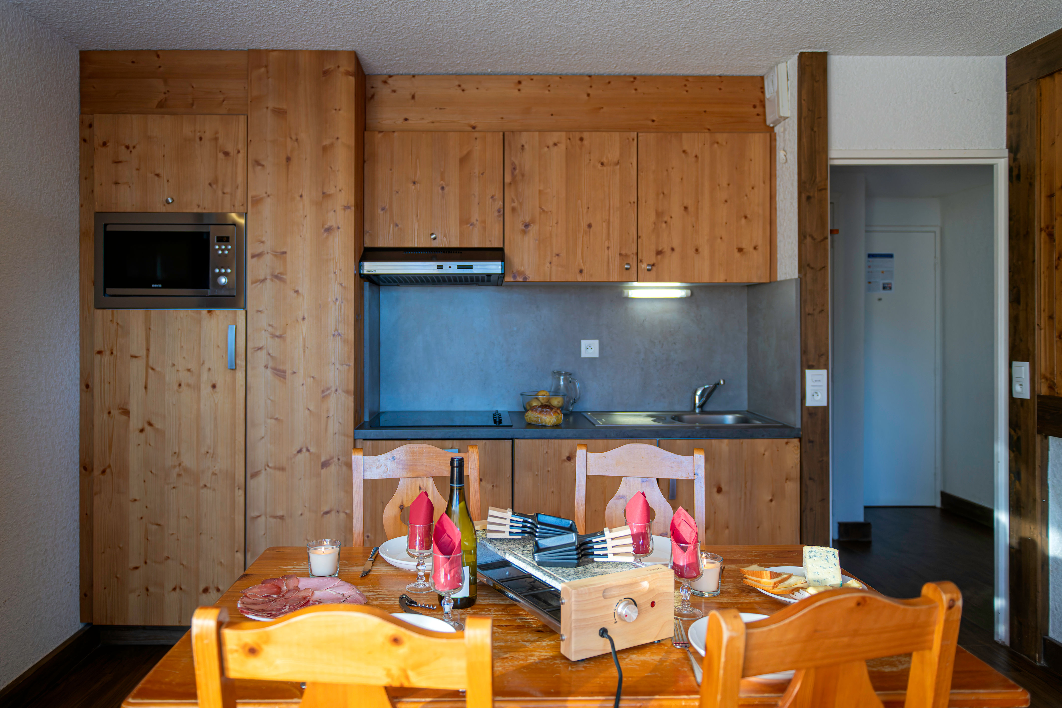 image Kitchenette with dining table set for a meal