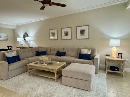 image Living area with plush sectional seating, warm natural light, and open sightlines to the kitchen