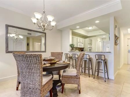 image Dining table in a warm, light-filled space with room for the whole group to gather