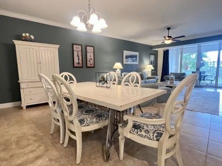 image Dining table with natural light from the balcony — open to the kitchen for easy group meals