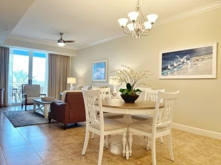 image Dining table in natural light with coastal artwork and room for the whole group