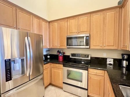 image Fully equipped kitchen with full-size appliances, dishwasher, cookware, and everything for a home-cooked meal