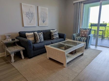 image Living area with plush seating, flat-screen TV, and nautical accents throughout