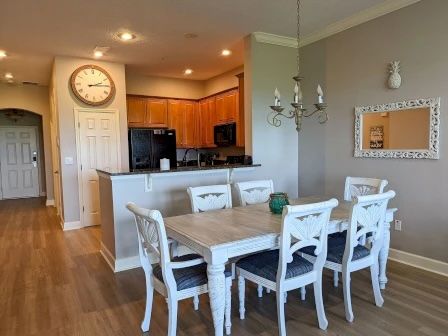 image Dining area with coastal decor and warm overhead lighting