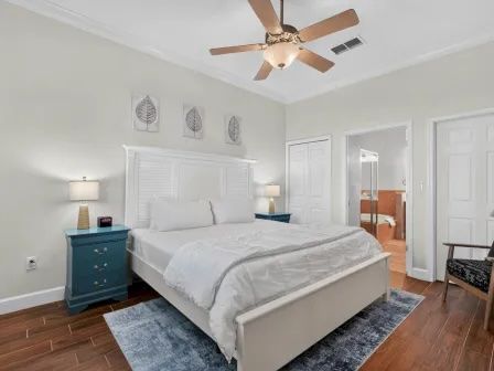 image King master bedroom with calm wall tones, white linens, and direct access to the ensuite