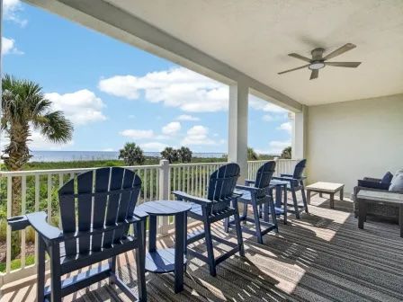 image Private balcony with cushioned seating overlooking the ocean — a good spot for morning coffee