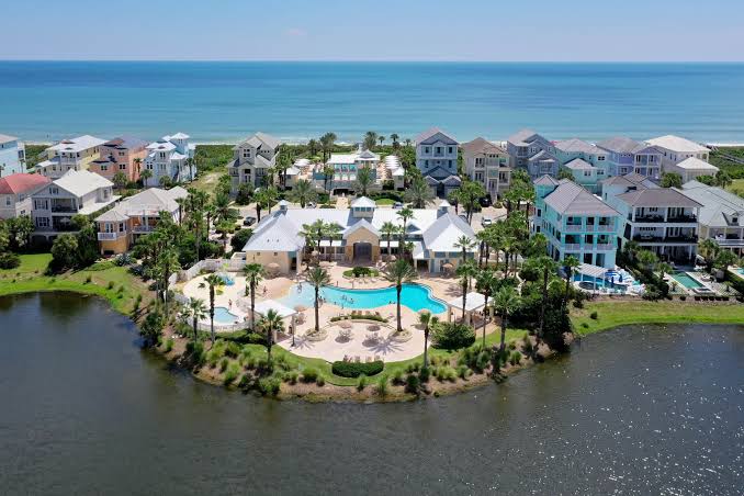 image Aerial view of the Cinnamon Beach clubhouse pool, nestled between the lake and the Atlantic Ocean