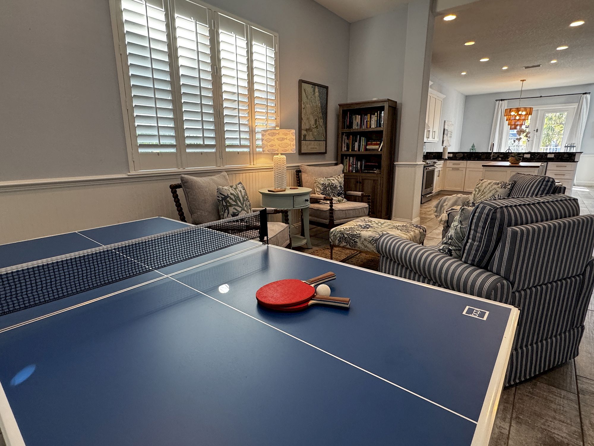 image Game room with ping-pong table and casual seating — great for rainy afternoons or post-pool downtime
