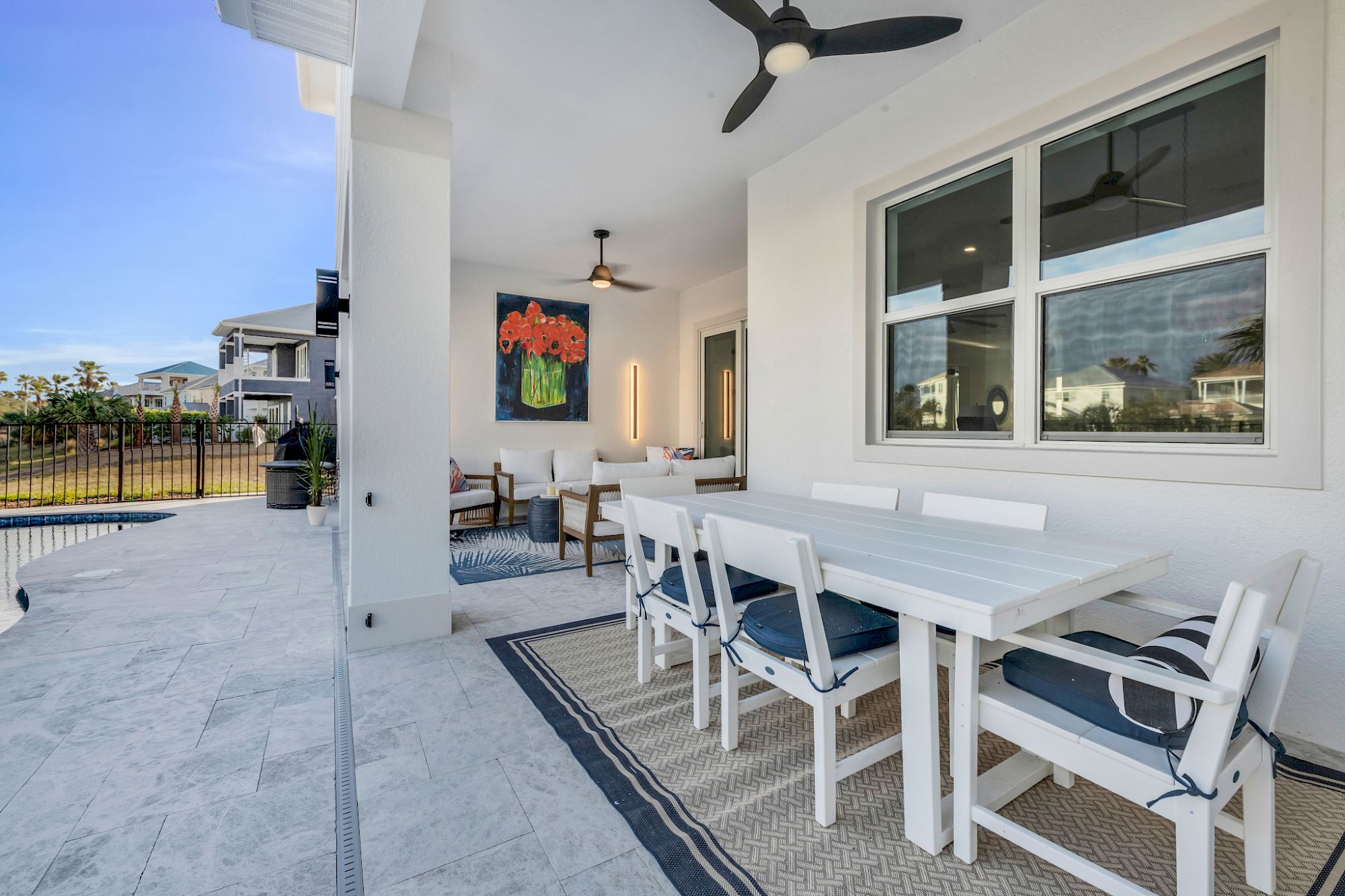 image Dining table with seating for the group beneath a statement pendant light