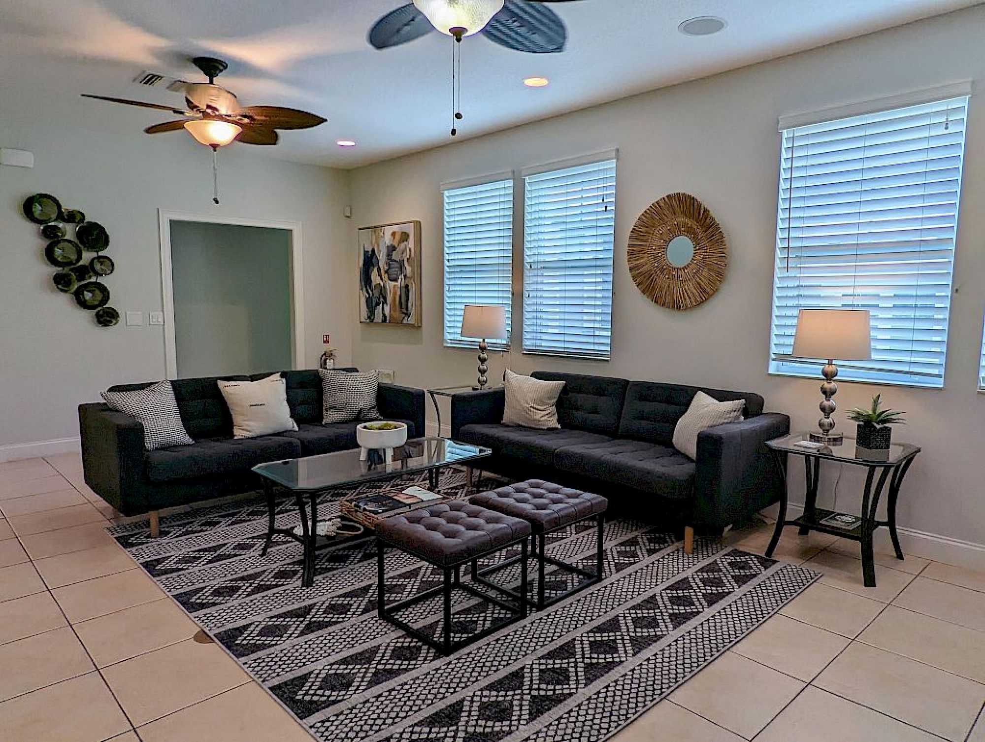 image Open living area with plush sectional seating, natural light, and direct sightlines to the pool courtyard