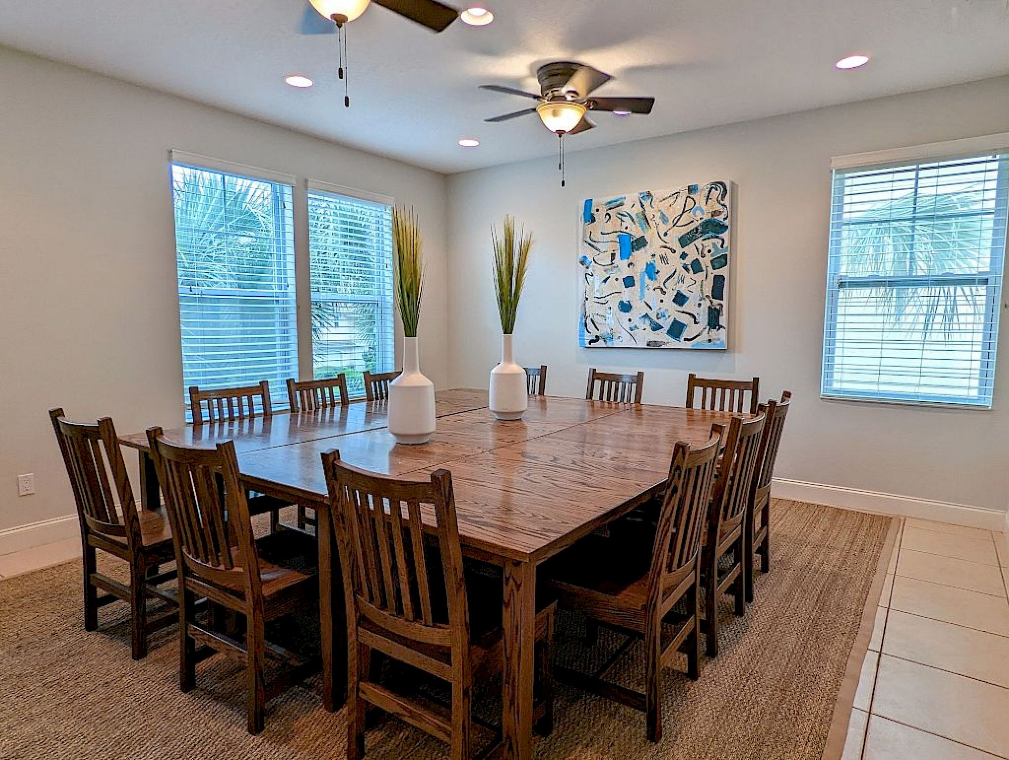 image Dining table with seating for the group beneath warm overhead lighting — easy for big family dinners