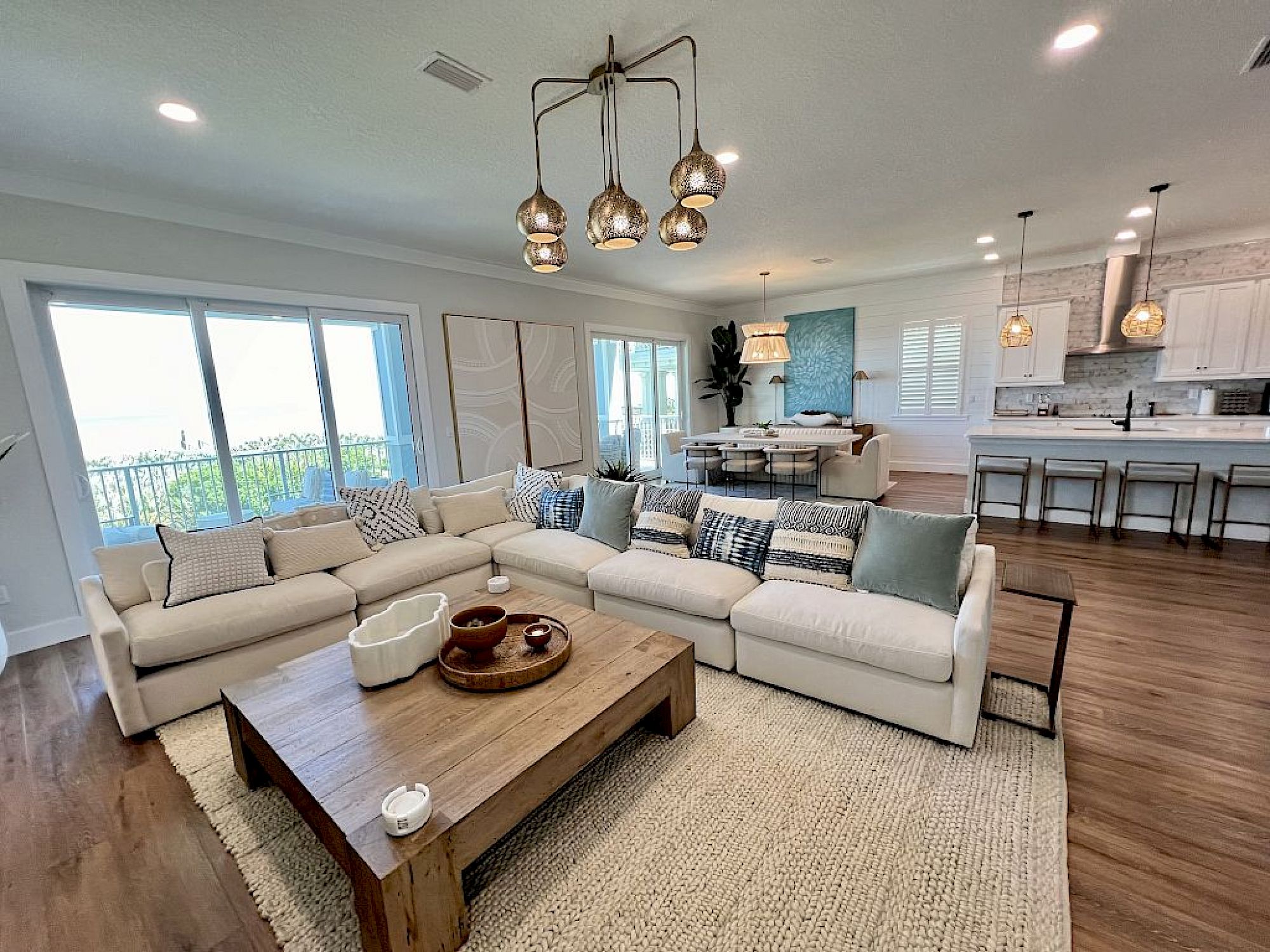 image Living area with pull-out queen sofa, artisan furnishings, and ocean views through large windows